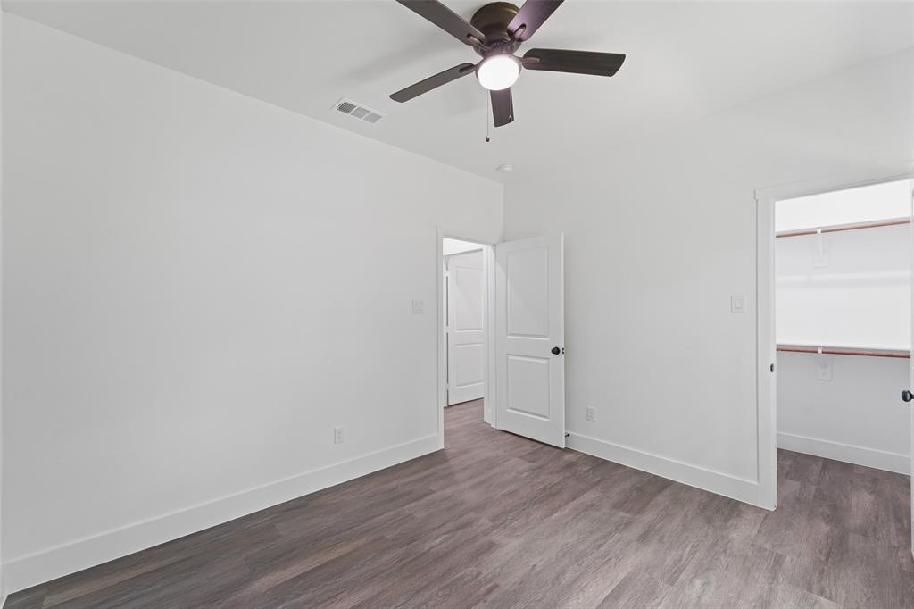 122 East Beachwood Loop Trinidad, TX 75163 - Photo 29 of 35 Interior room with wood-finish flooring, white walls, and a ceiling fan