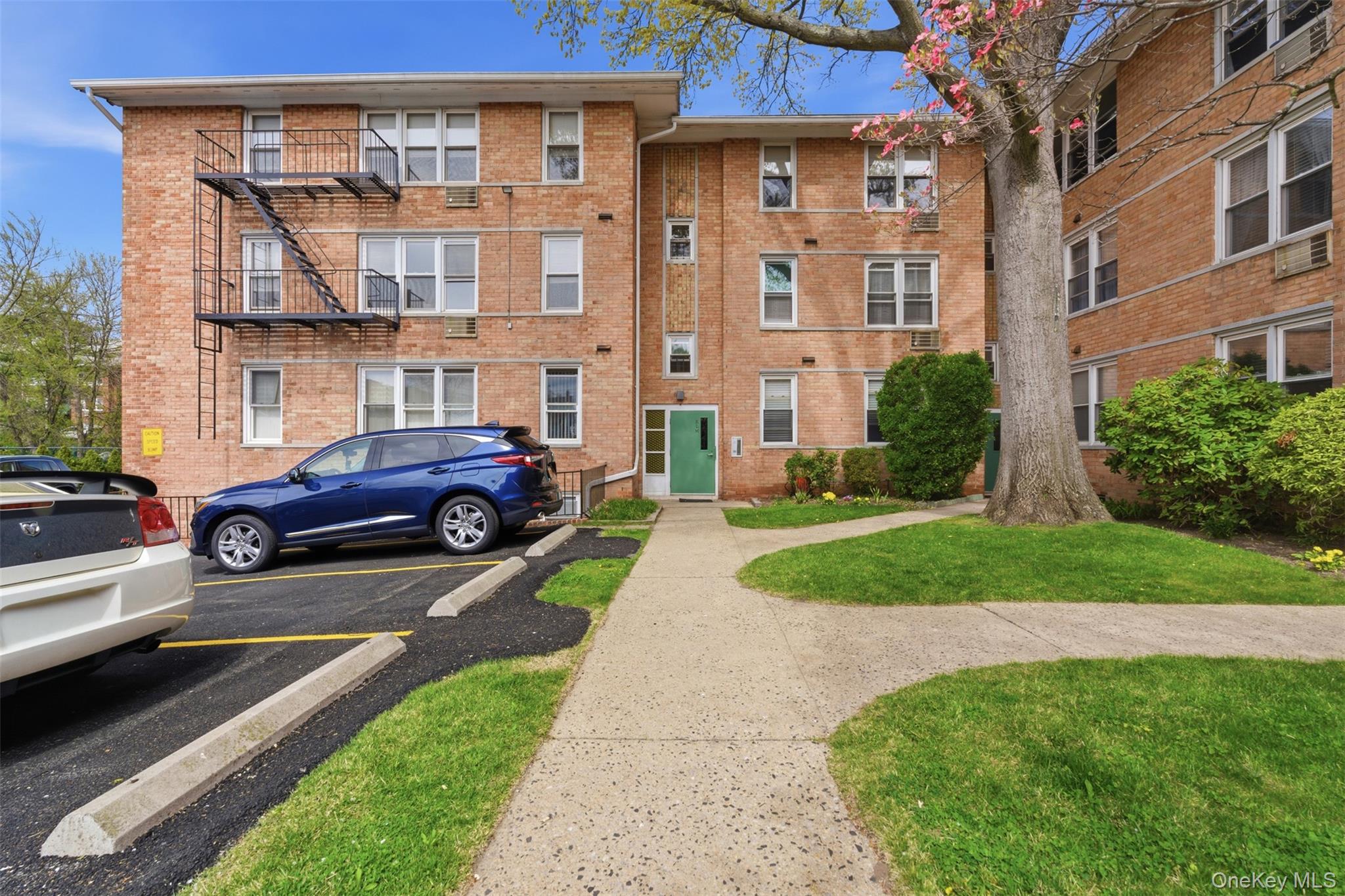 25 Trinity Place, Unit 2K New Rochelle, NY 10805 - Photo 2 of 24 One of three entrance to the building