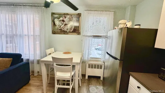 a dining room with furniture and window