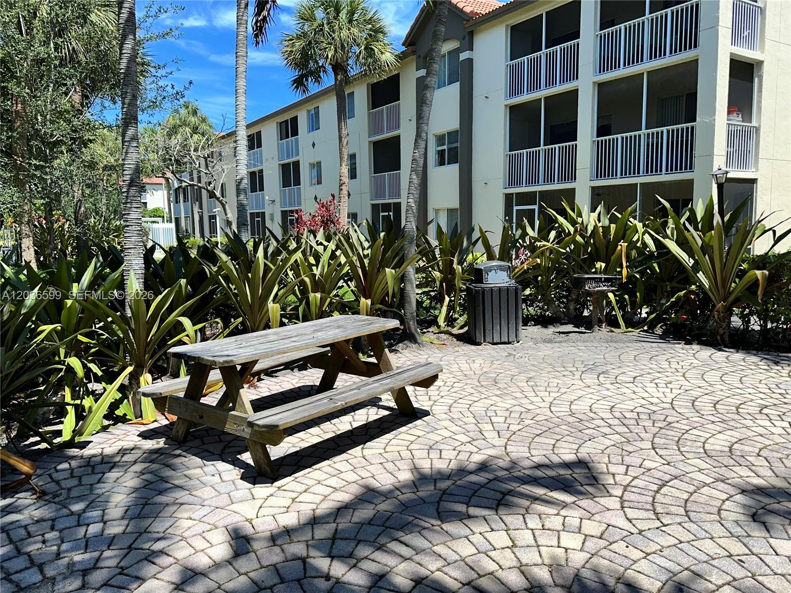 460 South Park Road, Unit 6203 Hollywood, FL 33021 - Photo 26 of 32 COMMUNITY PICNIC TABLE AND GRILL AREA