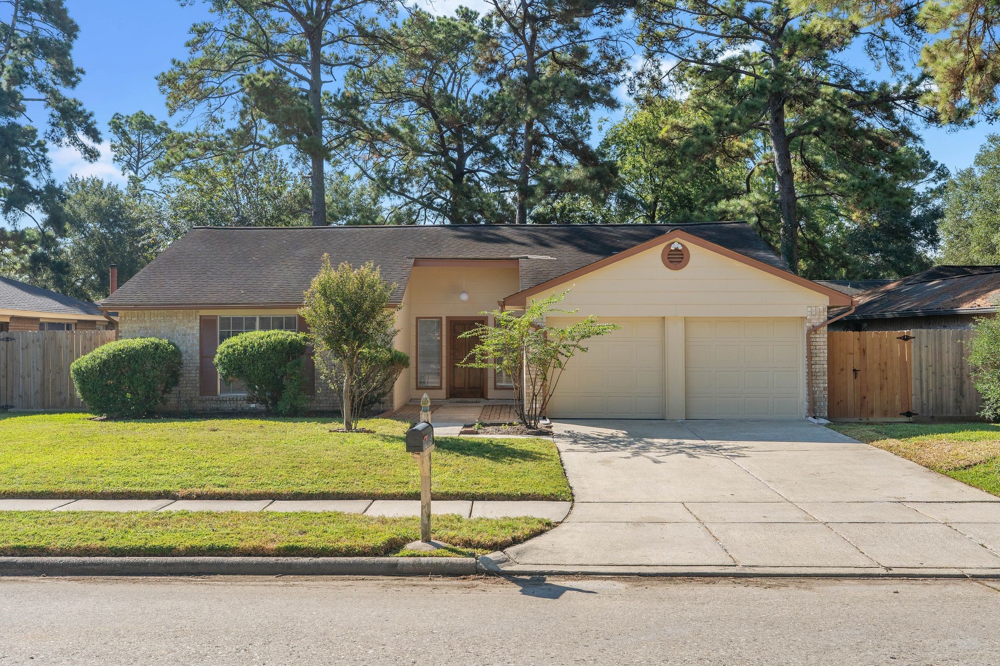 a front view of a house with a yard garage and outdoor seating