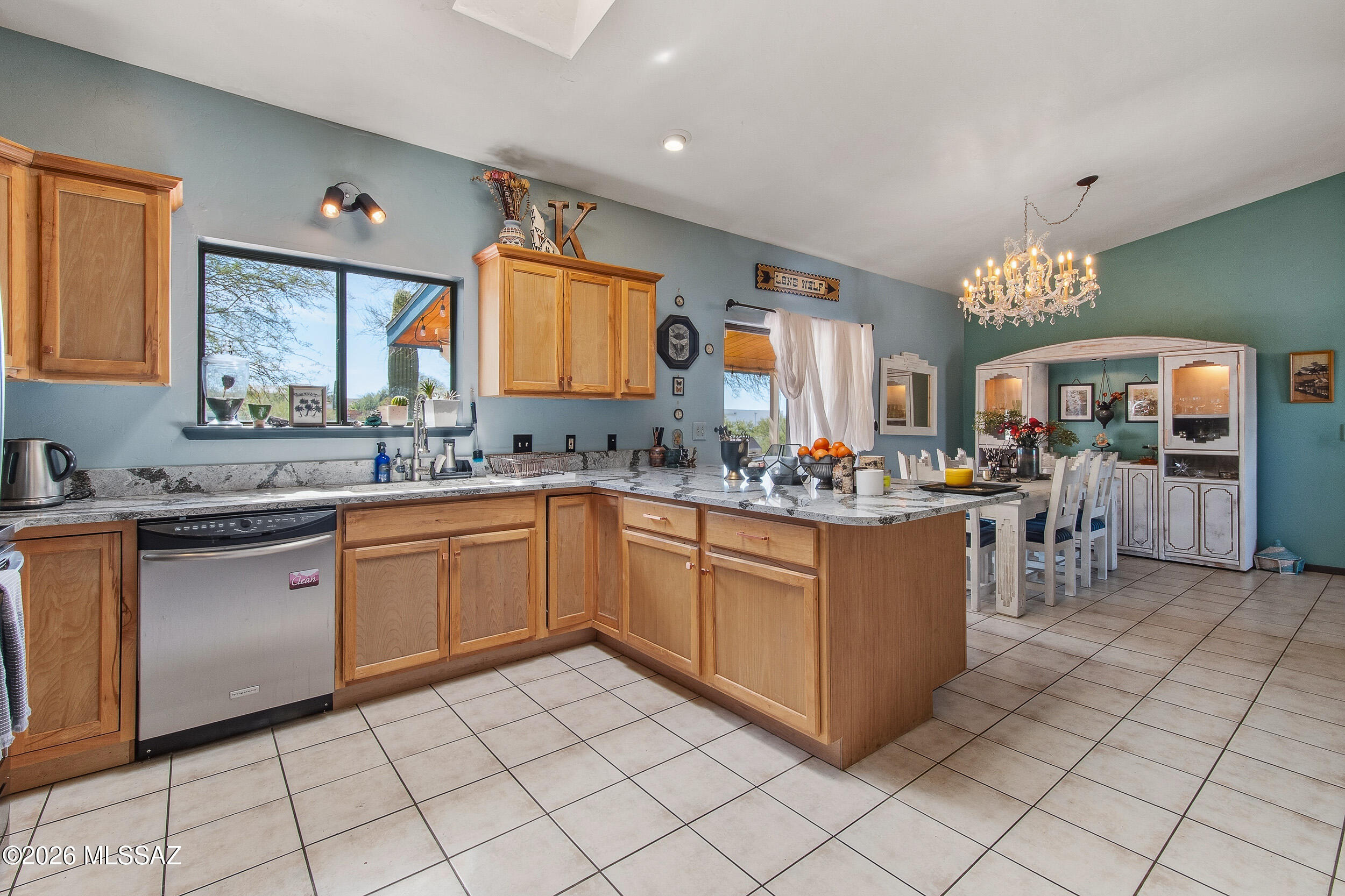 4155 West Coyote Ridge Trail Tucson, AZ 85746 - Photo 22 of 39 a kitchen with stainless steel appliances granite countertop a sink and cabinets