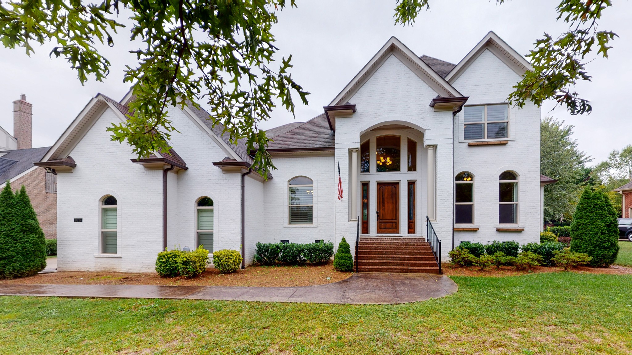 106 Stream Valley Boulevard Franklin, TN 37064 - Photo 1 of 1 a front view of a house with garden