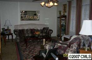 5219 Morgan Mill Road Monroe, NC 28110 - Photo 2 of 6 a view of a livingroom with furniture and window