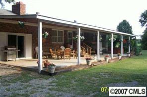 5219 Morgan Mill Road Monroe, NC 28110 - Photo 4 of 6 a view of a house with backyard porch and sitting area