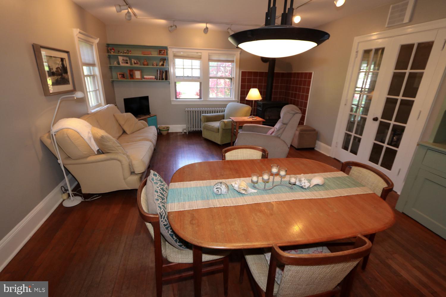 2701 Alden Road Bryn Athyn, PA 19006 - Photo 29 of 105 a living room with furniture a table and kitchen view