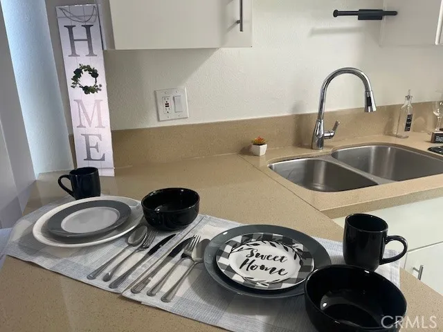 a kitchen with a table and a stove