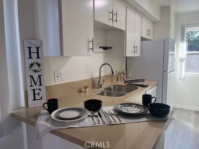 a kitchen with a table and chairs in it