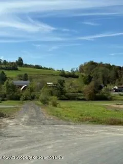 a view of a lake with a yard