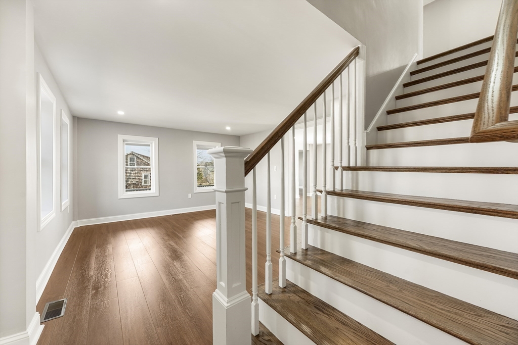 26 Maple Street Mendon, MA 01756 - Photo 12 of 42 a view of staircase with wooden floor and white walls