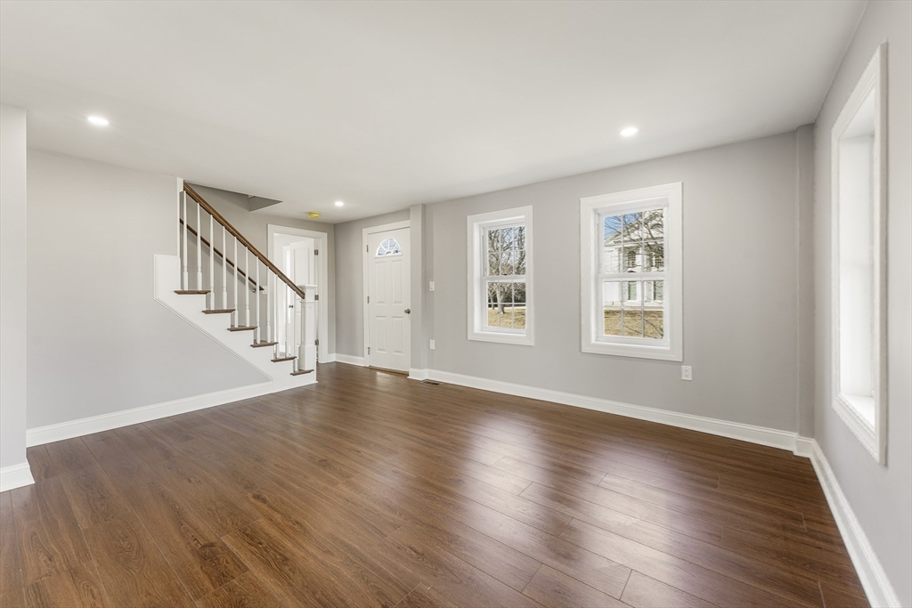 26 Maple Street Mendon, MA 01756 - Photo 14 of 42 a view of an empty room with wooden floor and a window