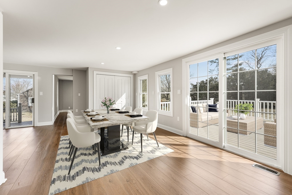 26 Maple Street Mendon, MA 01756 - Photo 20 of 42 a view of a dining room with furniture wooden floor and potted plants