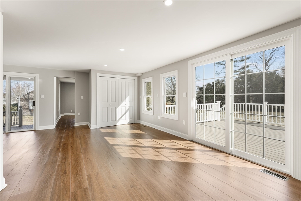 26 Maple Street Mendon, MA 01756 - Photo 21 of 42 a view of empty room with wooden floor and fan