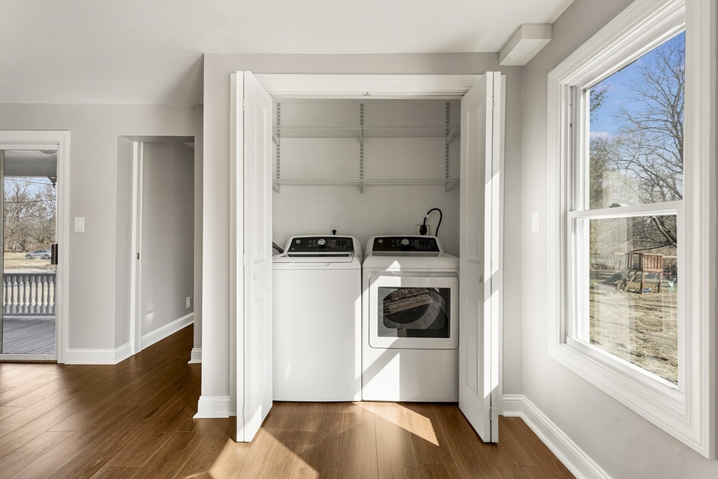 26 Maple Street Mendon, MA 01756 - Photo 22 of 42 a view of a kitchen with a refrigerator and a window