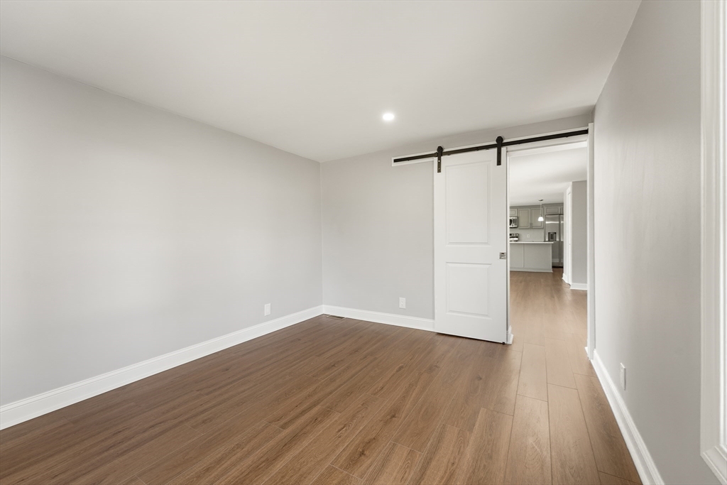 26 Maple Street Mendon, MA 01756 - Photo 25 of 42 a view of empty room with wooden floor