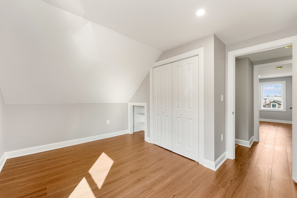 26 Maple Street Mendon, MA 01756 - Photo 31 of 42 wooden floor in an empty room with a window