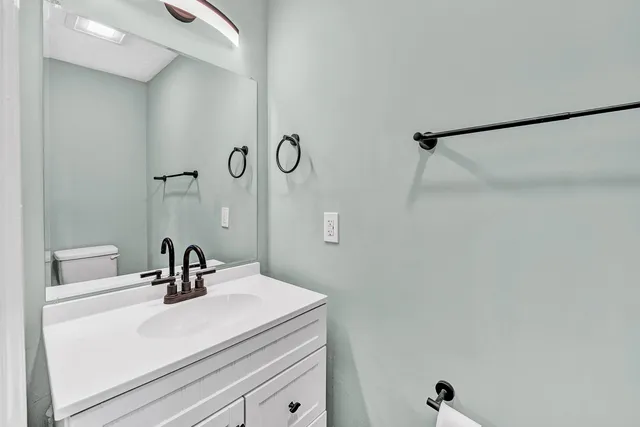 a bathroom with a sink and mirror