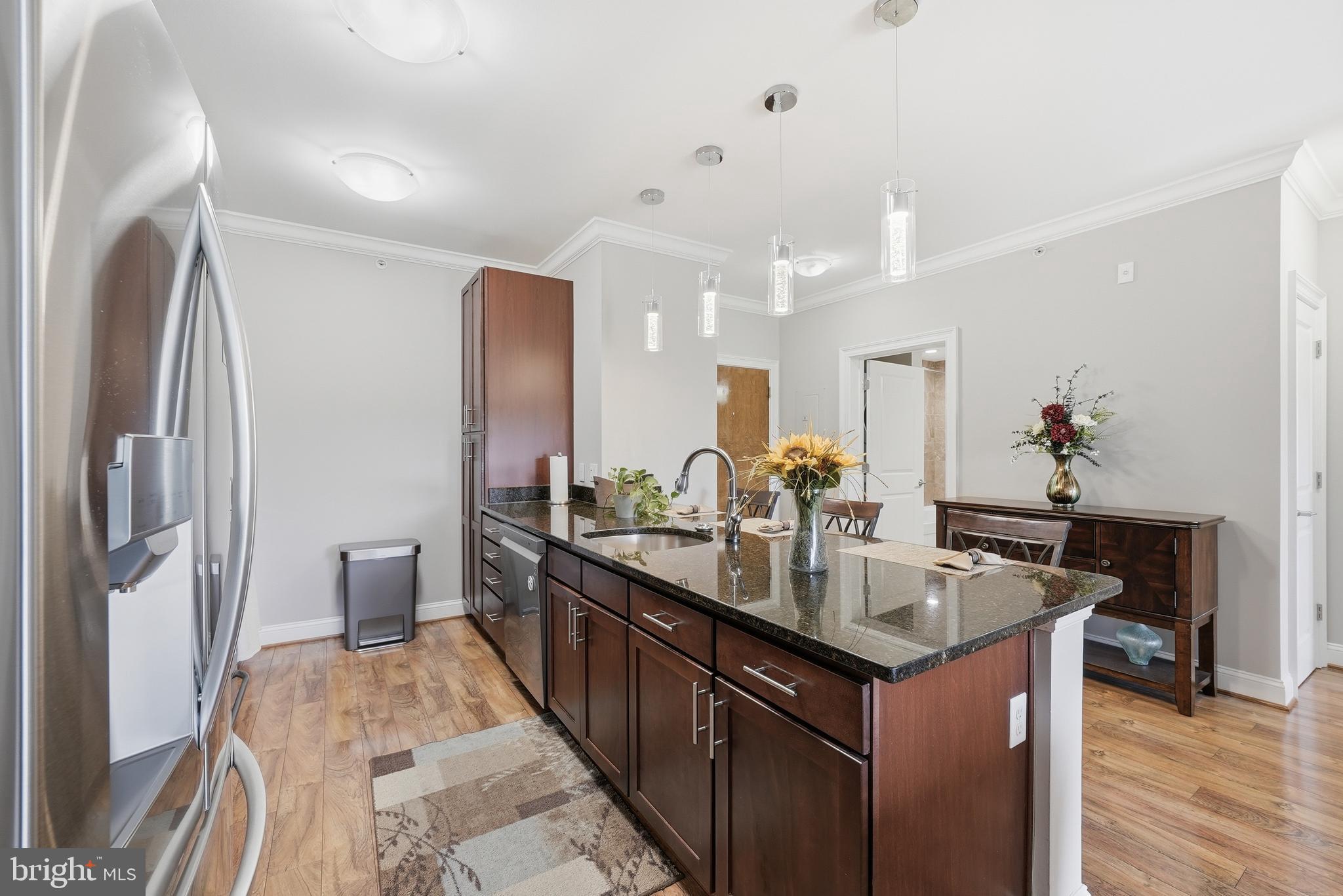 6301 Edsall Road, Unit 519 Alexandria, VA 22312 - Photo 5 of 33 a kitchen with stainless steel appliances granite countertop a sink and a refrigerator