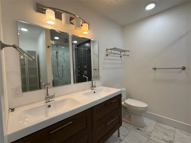 a bathroom with a shower and a toilet