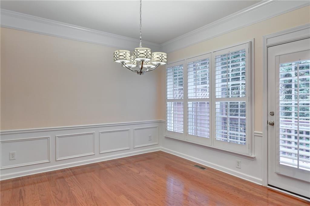 2804 Loftview Square, Unit 3 Atlanta, GA 30339 - Photo 15 of 36 a view of empty room with wooden floor and fan