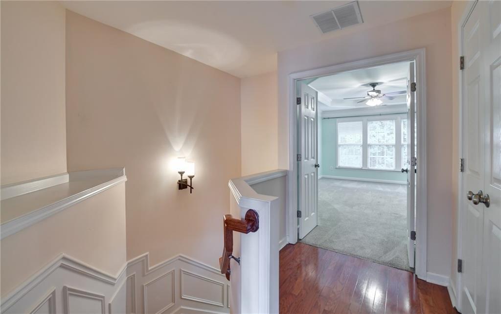 2804 Loftview Square, Unit 3 Atlanta, GA 30339 - Photo 18 of 36 a view of a livingroom with wooden floor and a fireplace