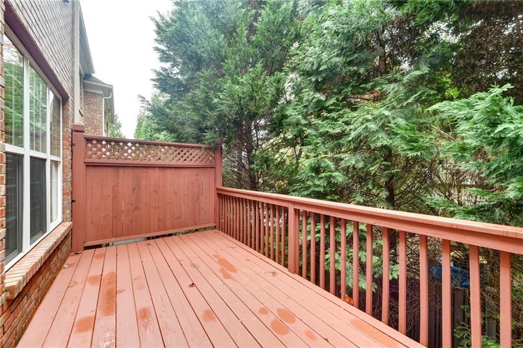 2804 Loftview Square, Unit 3 Atlanta, GA 30339 - Photo 19 of 36 a view of balcony with wooden floor and fence
