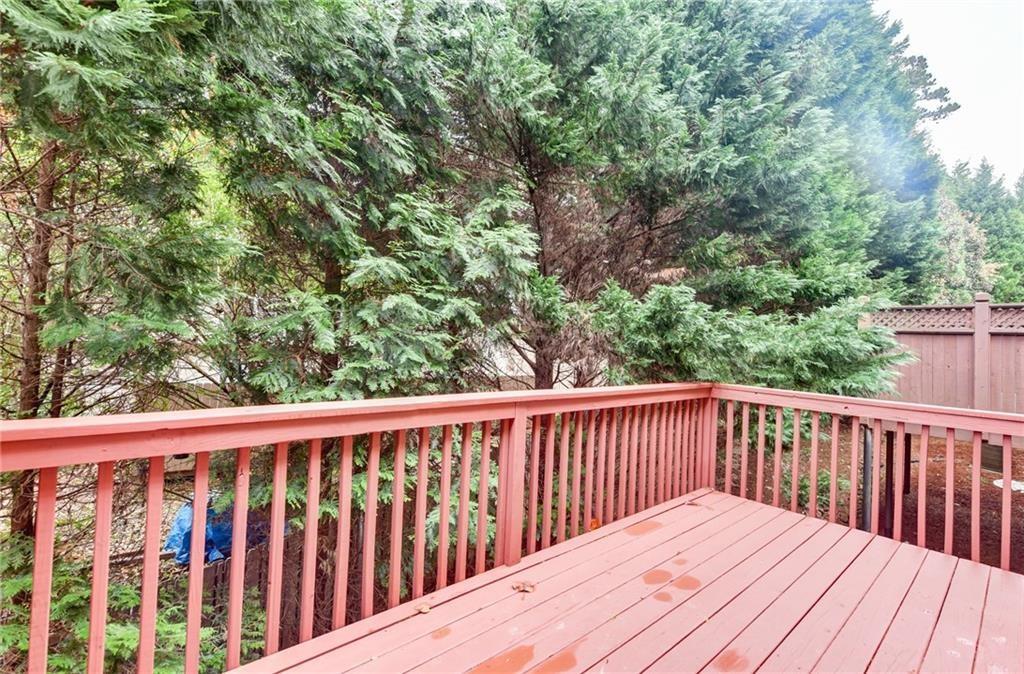 2804 Loftview Square, Unit 3 Atlanta, GA 30339 - Photo 20 of 36 a balcony with wooden floor and fence