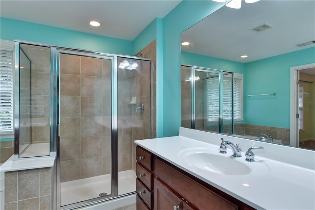 2804 Loftview Square, Unit 3 Atlanta, GA 30339 - Photo 24 of 36 a bathroom with a shower sink and mirror