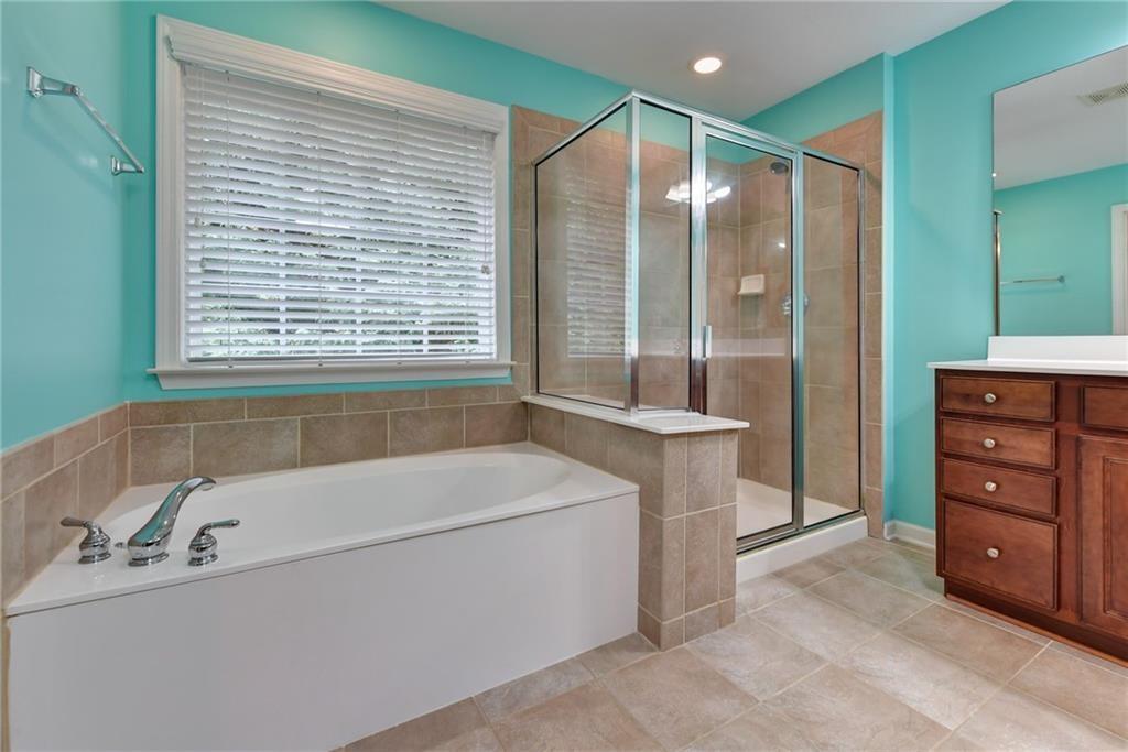 2804 Loftview Square, Unit 3 Atlanta, GA 30339 - Photo 26 of 36 a bathroom with a tub a sink and a large window