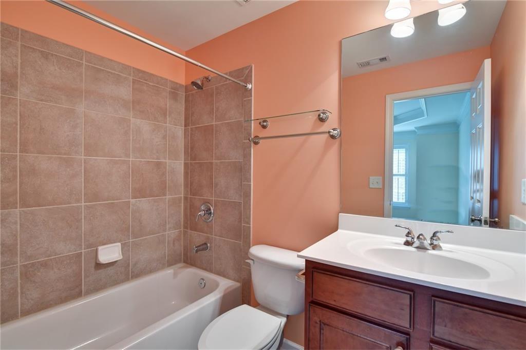 2804 Loftview Square, Unit 3 Atlanta, GA 30339 - Photo 30 of 36 a bathroom with a sink toilet a mirror and shower