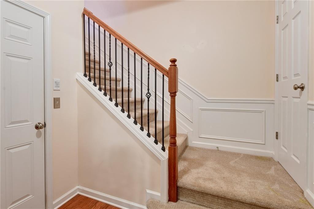 2804 Loftview Square, Unit 3 Atlanta, GA 30339 - Photo 32 of 36 a view of staircase with white walls and white door