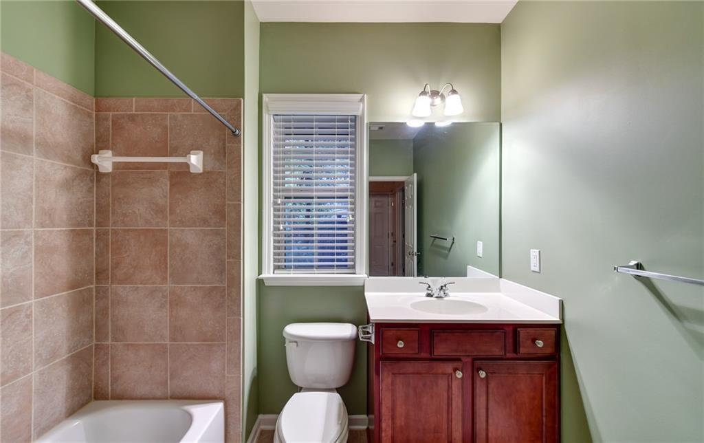 2804 Loftview Square, Unit 3 Atlanta, GA 30339 - Photo 34 of 36 a bathroom with a sink and a mirror