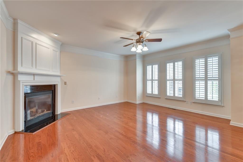 2804 Loftview Square, Unit 3 Atlanta, GA 30339 - Photo 7 of 36 a view of an empty room with chandelier fan and fire place