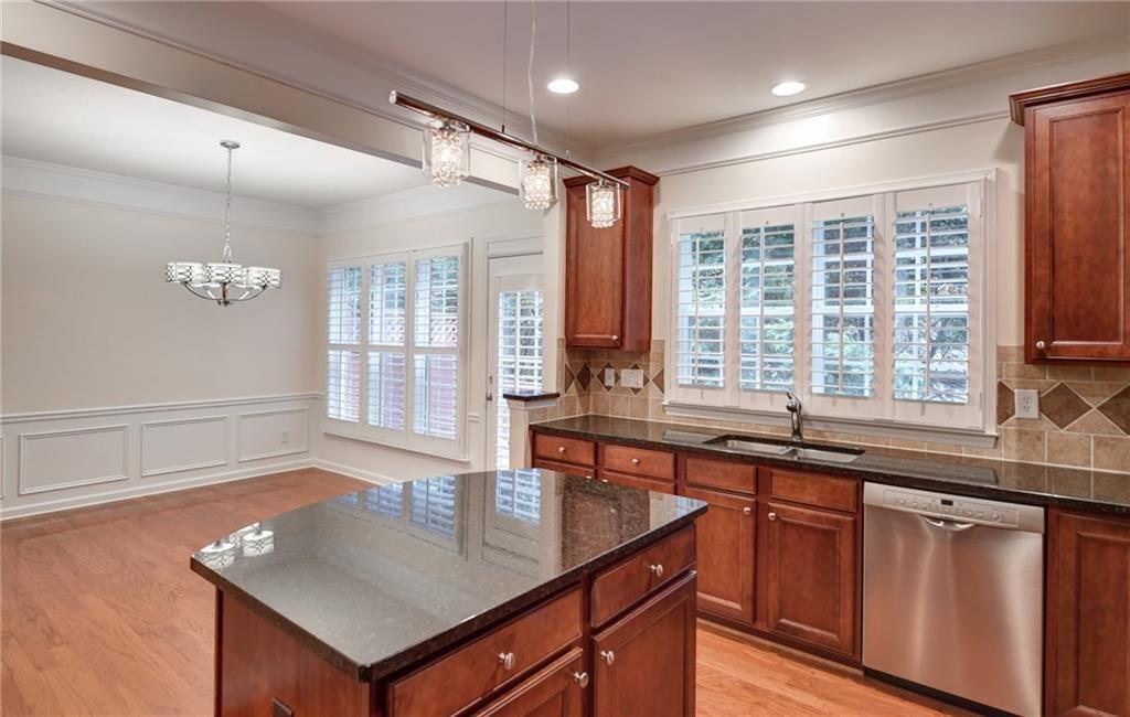 2804 Loftview Square, Unit 3 Atlanta, GA 30339 - Photo 9 of 36 a kitchen with a sink window and cabinets