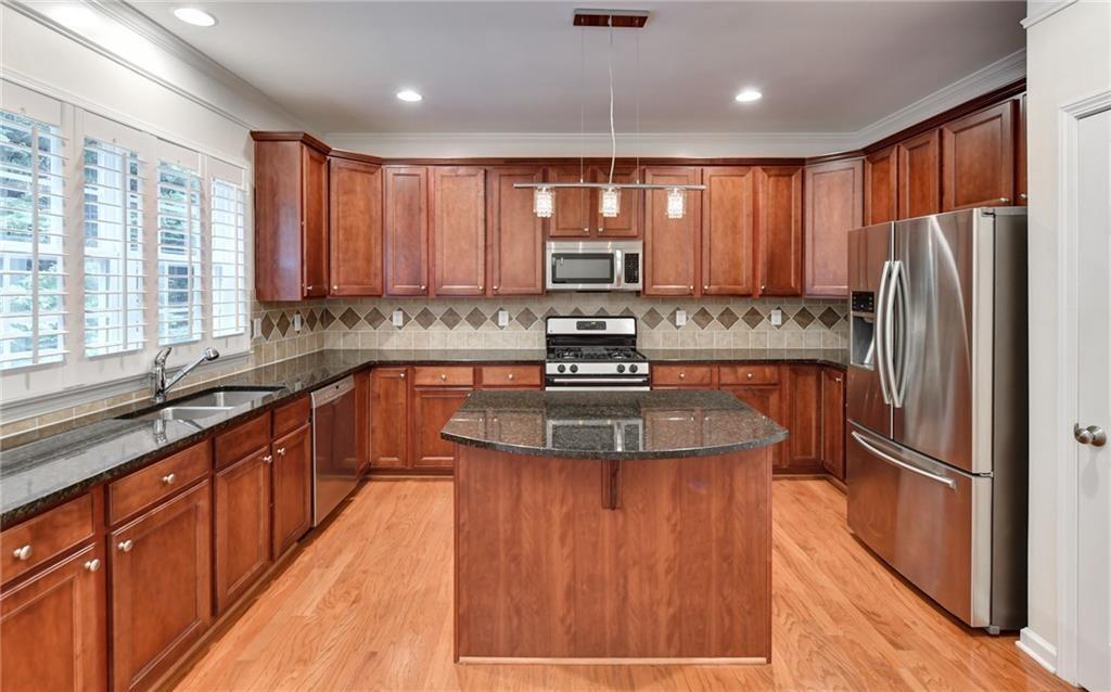 2804 Loftview Square, Unit 3 Atlanta, GA 30339 - Photo 10 of 36 a kitchen with stainless steel appliances granite countertop refrigerator a sink and a stove