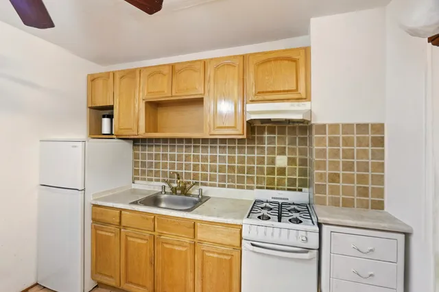 a view of small space with wooden floor and closet