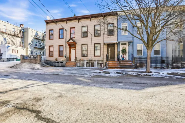 a kitchen with a refrigerator and a stove