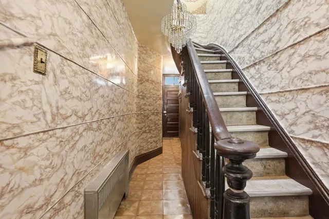 a bathroom with a shower and a mirror