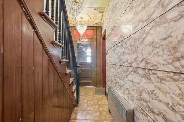 a view of a house with a door and a wooden fence
