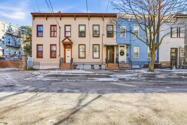 aerial view of a house with a yard