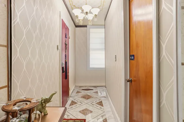 a bathroom with a toilet and a shower curtain