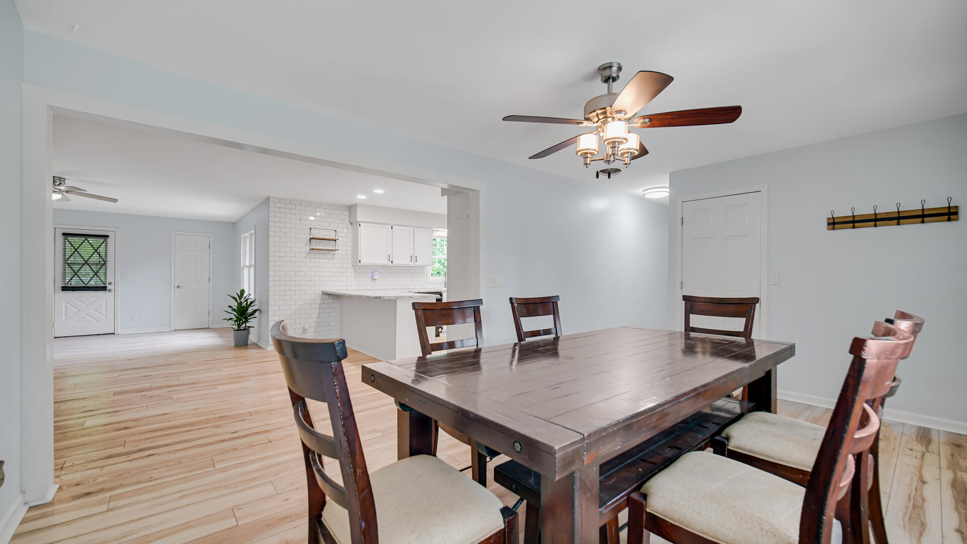 6717 State Rte 49 Rensselaer, IN 47978 - Photo 7 of 31 a view of a dining room with furniture and wooden floor
