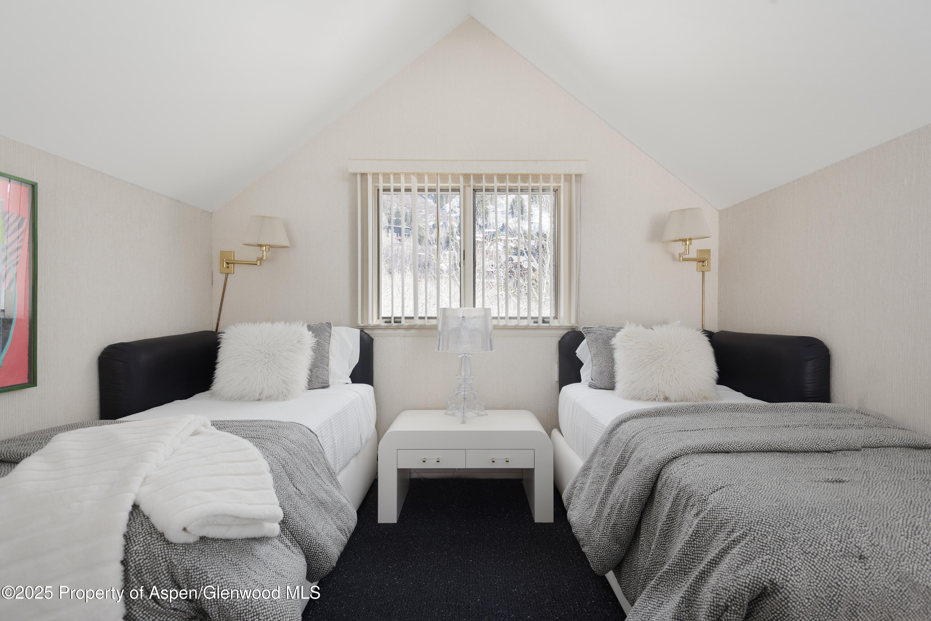 60 Northway Drive Aspen, CO 81611 - Photo 18 of 32 a bedroom with two beds and a large window