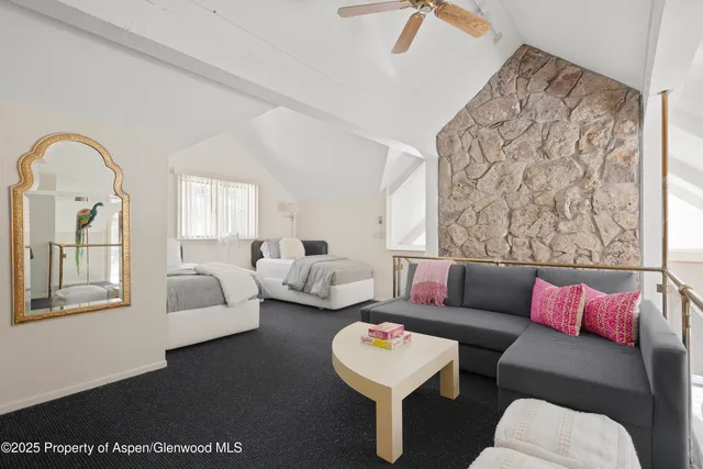 a bedroom with furniture and a window