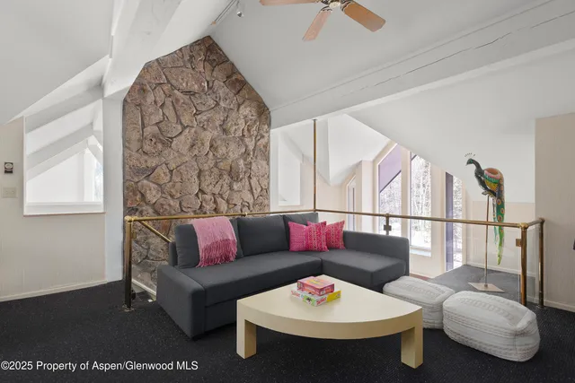 a bathroom with a granite countertop sink a toilet and a mirror