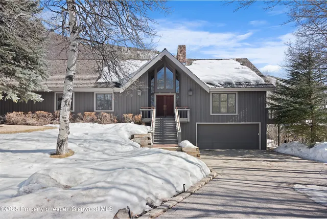 a balcony with wooden floor and fence