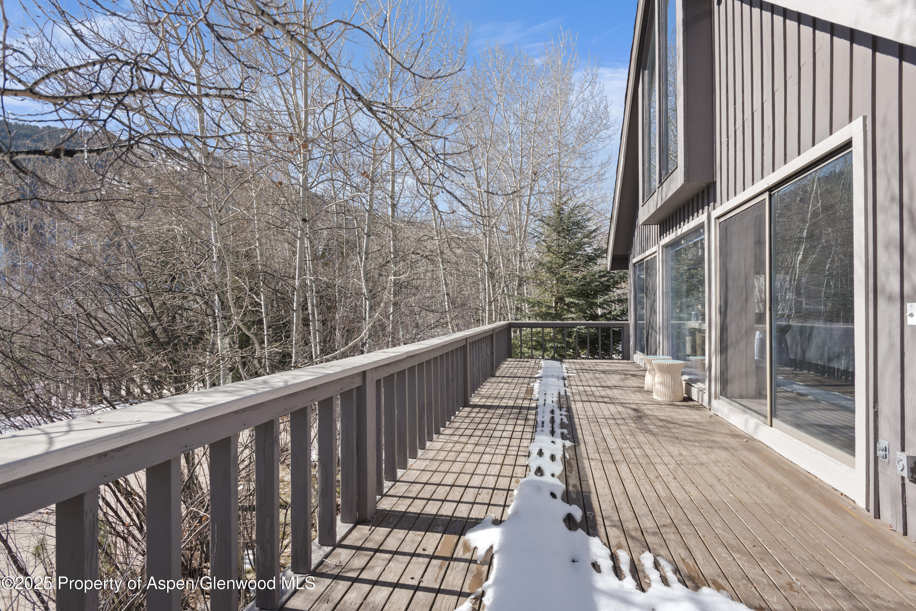 60 Northway Drive Aspen, CO 81611 - Photo 30 of 32 a balcony with wooden floor and fence