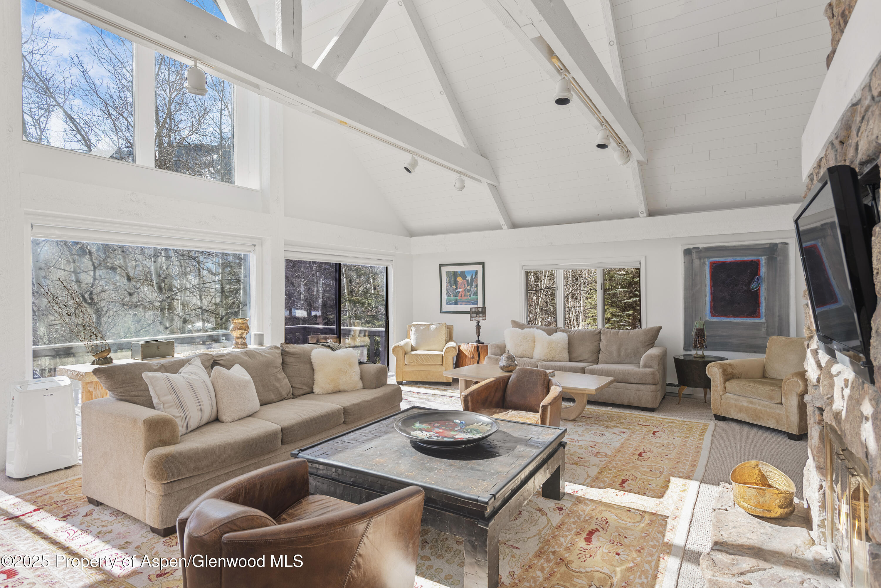 60 Northway Drive Aspen, CO 81611 - Photo 4 of 32 a living room with furniture and a large window