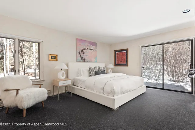 a close view of a sink a stove and a dining table in a bathroom