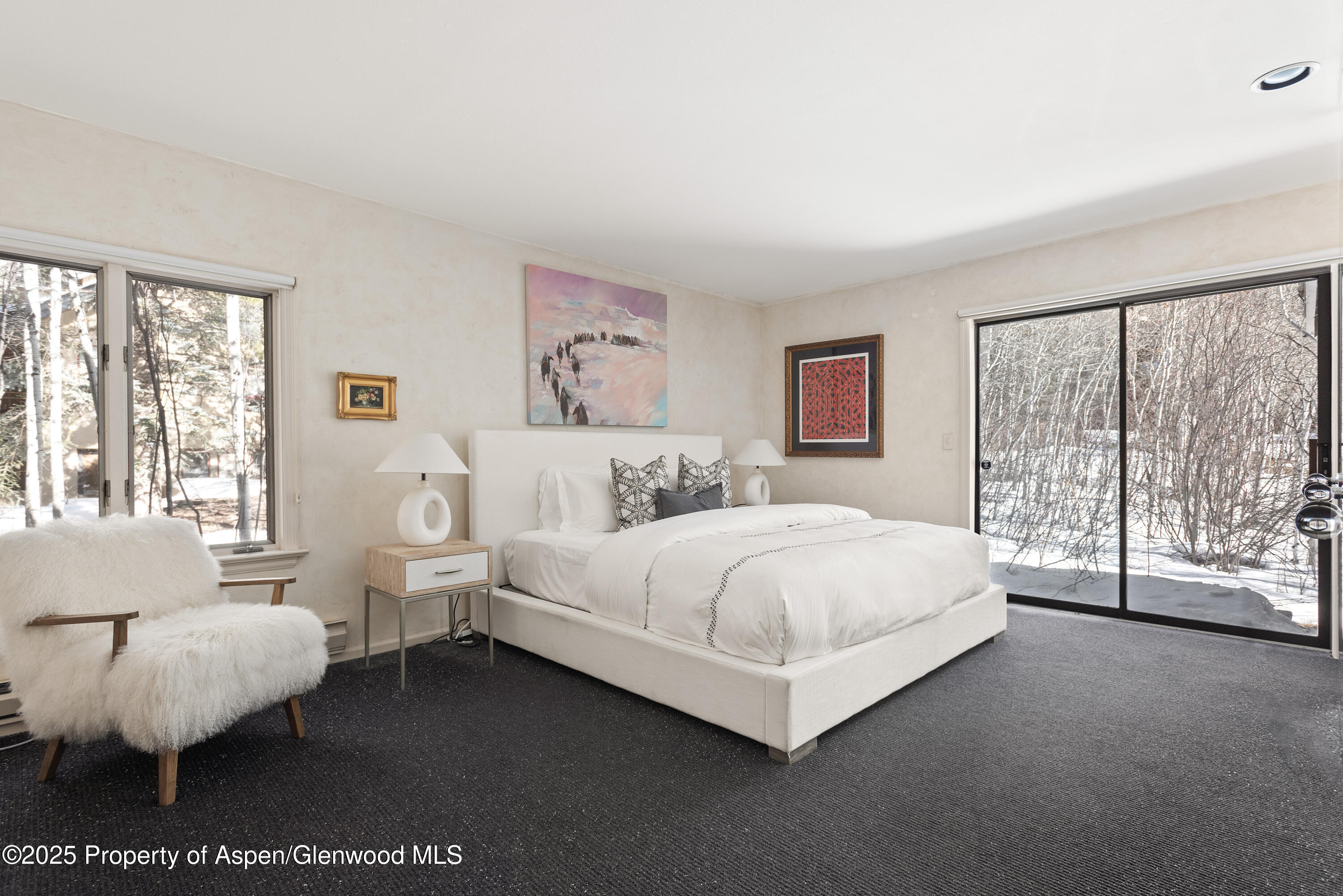 60 Northway Drive Aspen, CO 81611 - Photo 10 of 32 a spacious bedroom with a bed and a large window